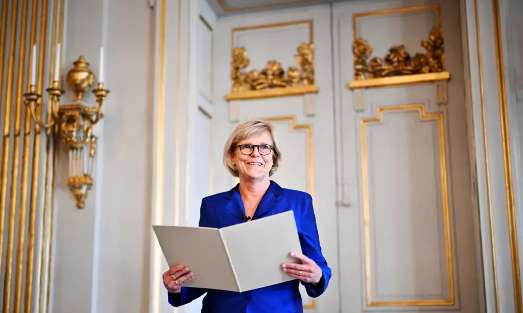 The Permanent Secretary of the Swedish Academy, Ingrid Carlberg, announces that Canadian author Anne Carson is awarded the Nobel Prize in Literature 2026, in Stockholm, Sweden, October 8, 2026. TT News Agency/Christine Olsson via REUTERS ATTENTION EDITORS - THIS IMAGE WAS PROVIDED BY A THIRD PARTY. SWEDEN OUT. NO COMMERCIAL OR EDITORIAL SALES IN SWEDEN.