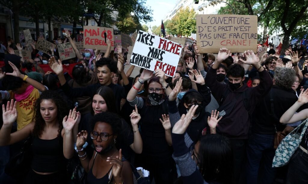 French high school students hold placards during a demonstration by high school and university students, parents' associations, and education labour unions, in Paris as part of a nationwide day of demonstrations and blockades, voicing anger over overcrowded classrooms, teacher shortages and dilapidated school buildings, which students blame on years of underinvestment, France, October 6, 2026. REUTERS/Tom Nicholson