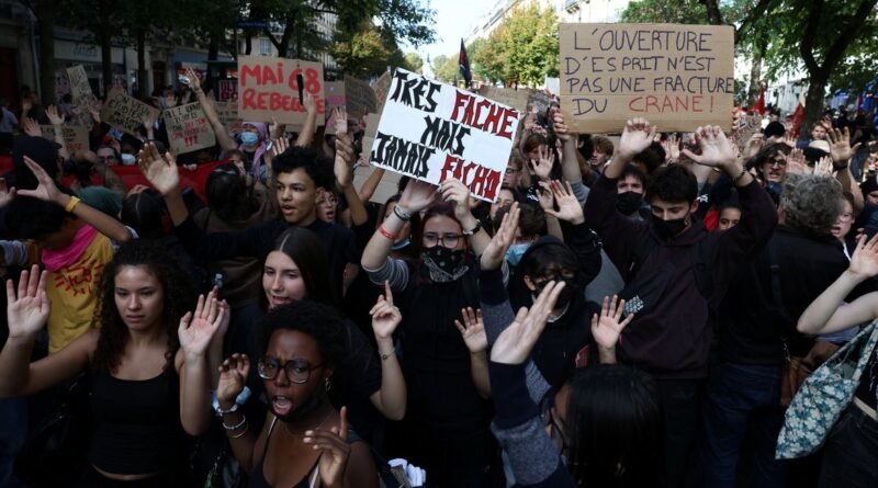 French high school students hold placards during a demonstration by high school and university students, parents' associations, and education labour unions, in Paris as part of a nationwide day of demonstrations and blockades, voicing anger over overcrowded classrooms, teacher shortages and dilapidated school buildings, which students blame on years of underinvestment, France, October 6, 2026. REUTERS/Tom Nicholson