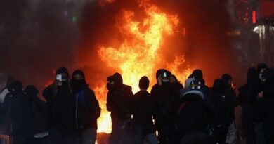 Flames and smoke rise during civil unrest, the day after a national day of demonstrations against the cost of living and rising fuel prices, in Paris, France, October 18, 2026. REUTERS/Abdul Saboor