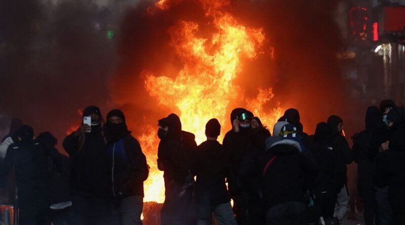 Flames and smoke rise during civil unrest, the day after a national day of demonstrations against the cost of living and rising fuel prices, in Paris, France, October 18, 2026. REUTERS/Abdul Saboor
