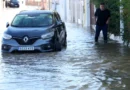 A man walks in a flooded street, following torrential rain, in Oliva, Valencia province, Spain, October 20, 2026. REUTERS/Eva Manez
