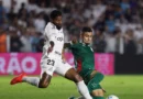 Soccer Football - Brasileiro Championship - Santos v Palmeiras - Estadio Urbano Caldeira, Santos, Brazil - October 28, 2026 Palmeiras' Andreas Pereira in action with Santos' Rodinei REUTERS/Thiago Bernardes
