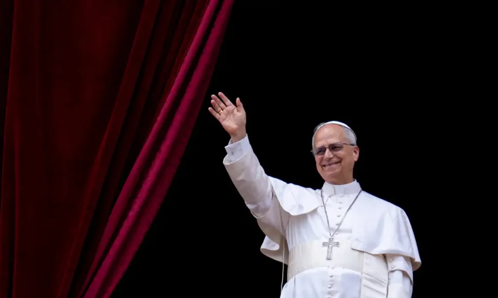 Pope Leo XIV waves to the crowd during the Regina Caeli prayer from the main central loggia of St. Peter's Basilica in The Vatican, on May 11, 2025 (Photo by Massimo Valicchia/NurPhoto).NO USE FRANCE