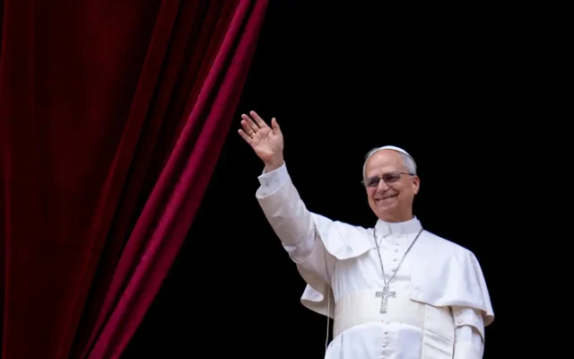 Pope Leo XIV waves to the crowd during the Regina Caeli prayer from the main central loggia of St. Peter's Basilica in The Vatican, on May 11, 2025 (Photo by Massimo Valicchia/NurPhoto).NO USE FRANCE
